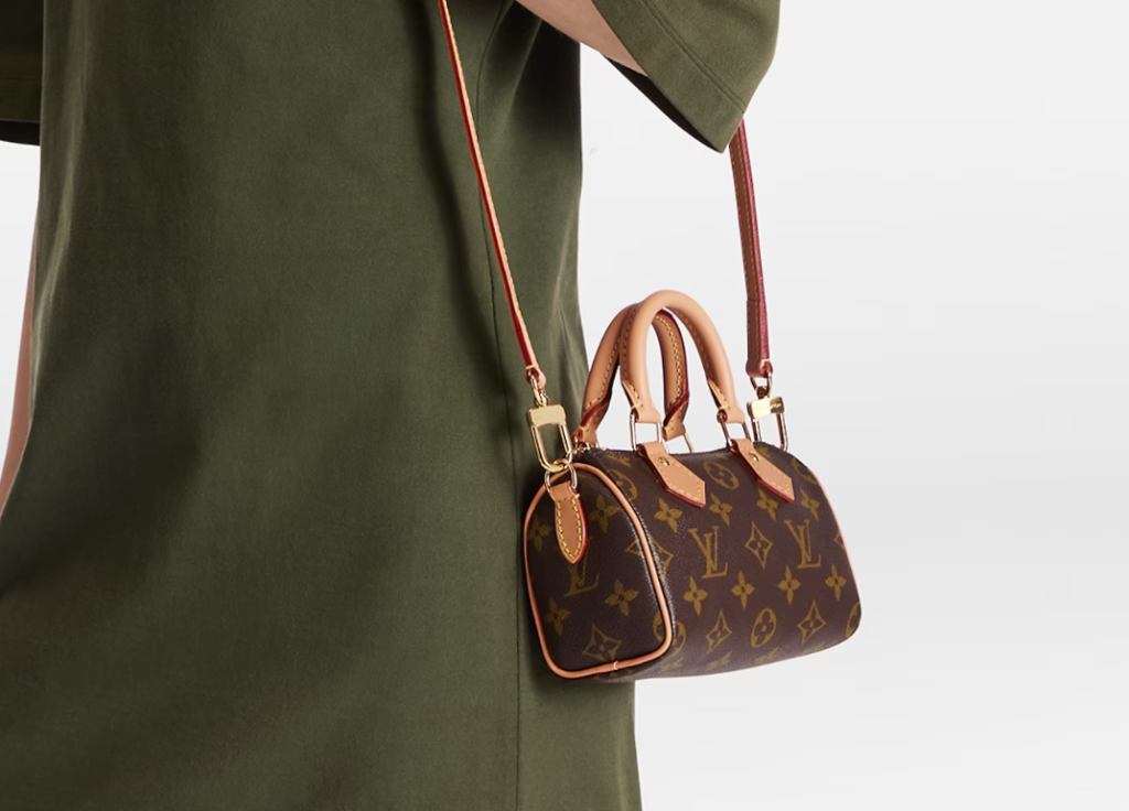 The 2024 edition of the Louis Vuitton Keepall Bandoulière, featuring the iconic monogram canvas with an adjustable shoulder strap and elegant leather accents, perfect for luxury travel.