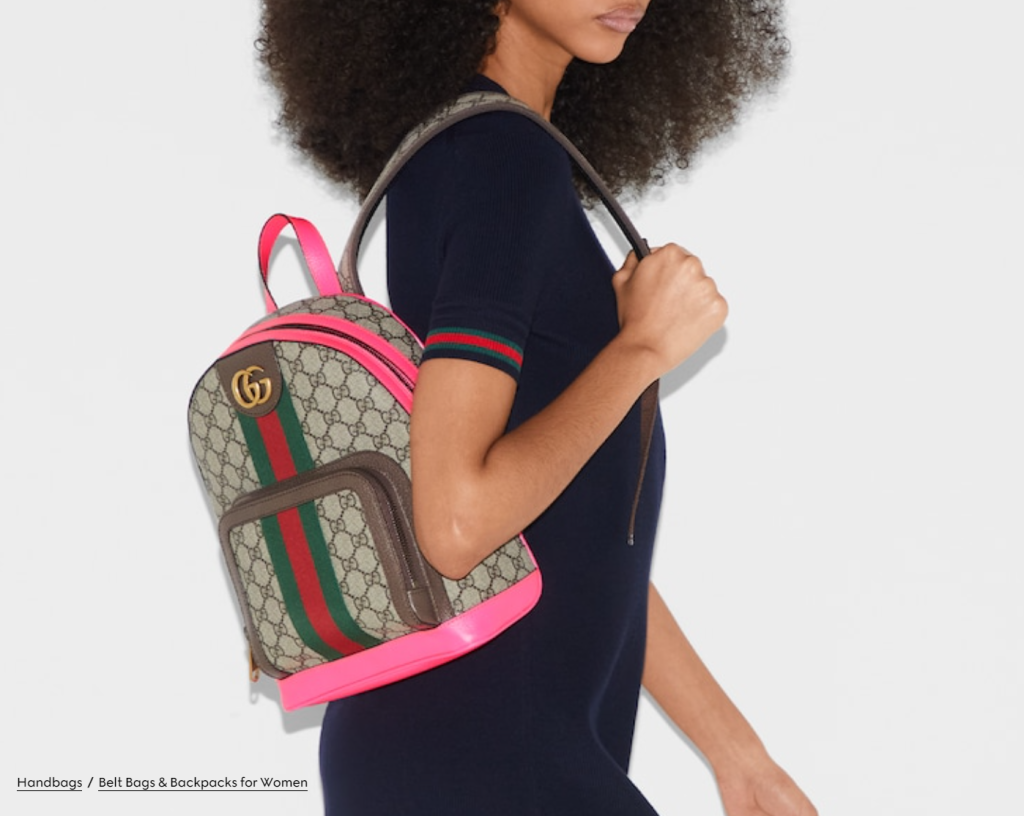 A green eco-friendly canvas backpack with multiple compartments and padded straps, made from organic cotton and recycled materials, perfect for daily use and outdoor activities.